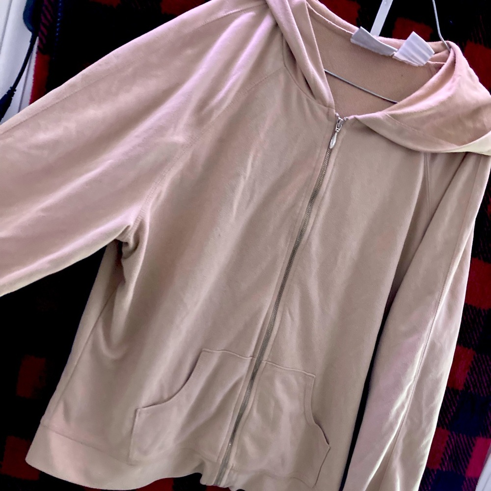 A tan velvet zip up jacket